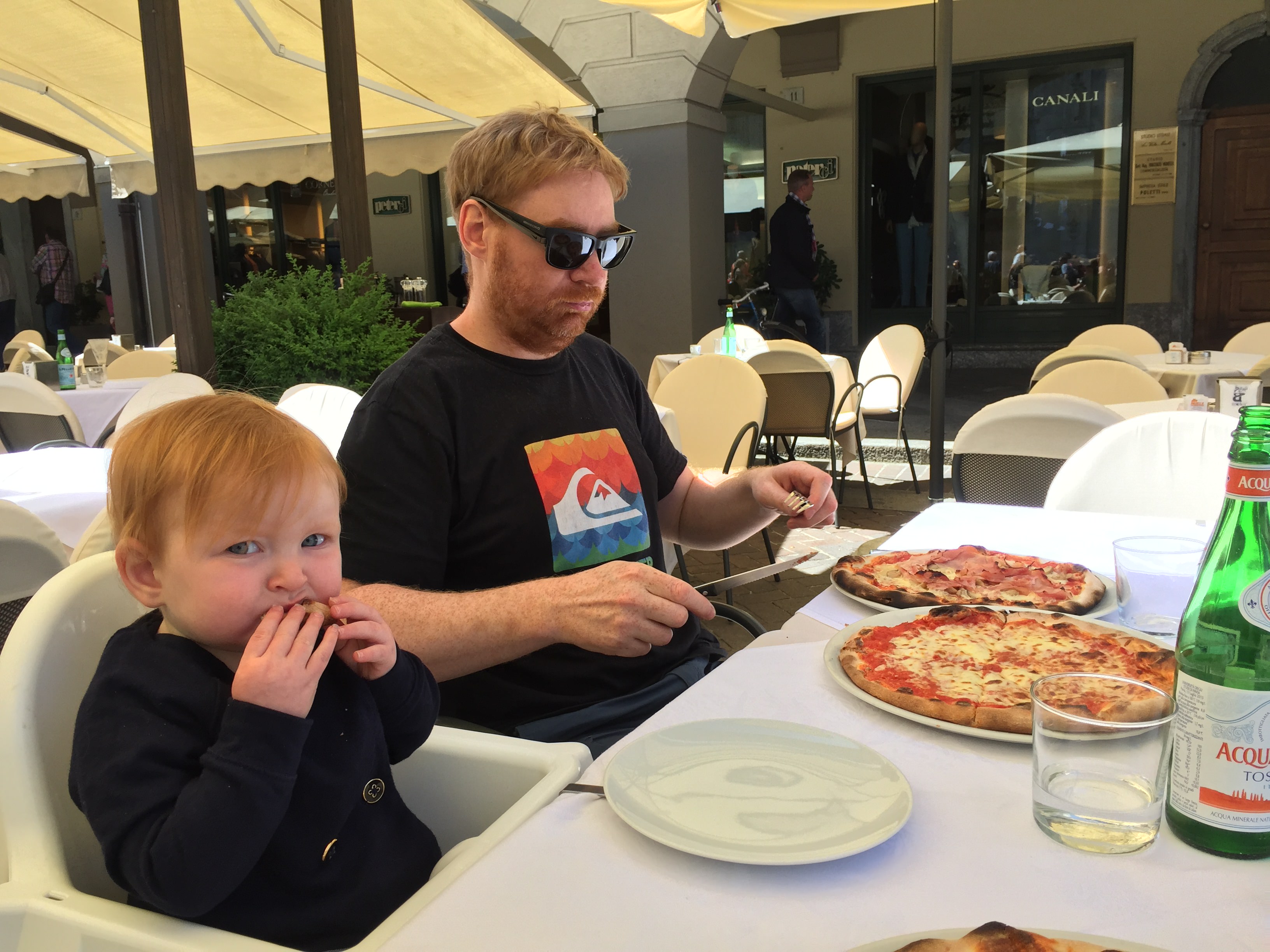 Hazel Eating Pizza in Lake Como, Italy