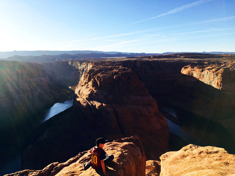 Man Sitting at Horseshoe Bend