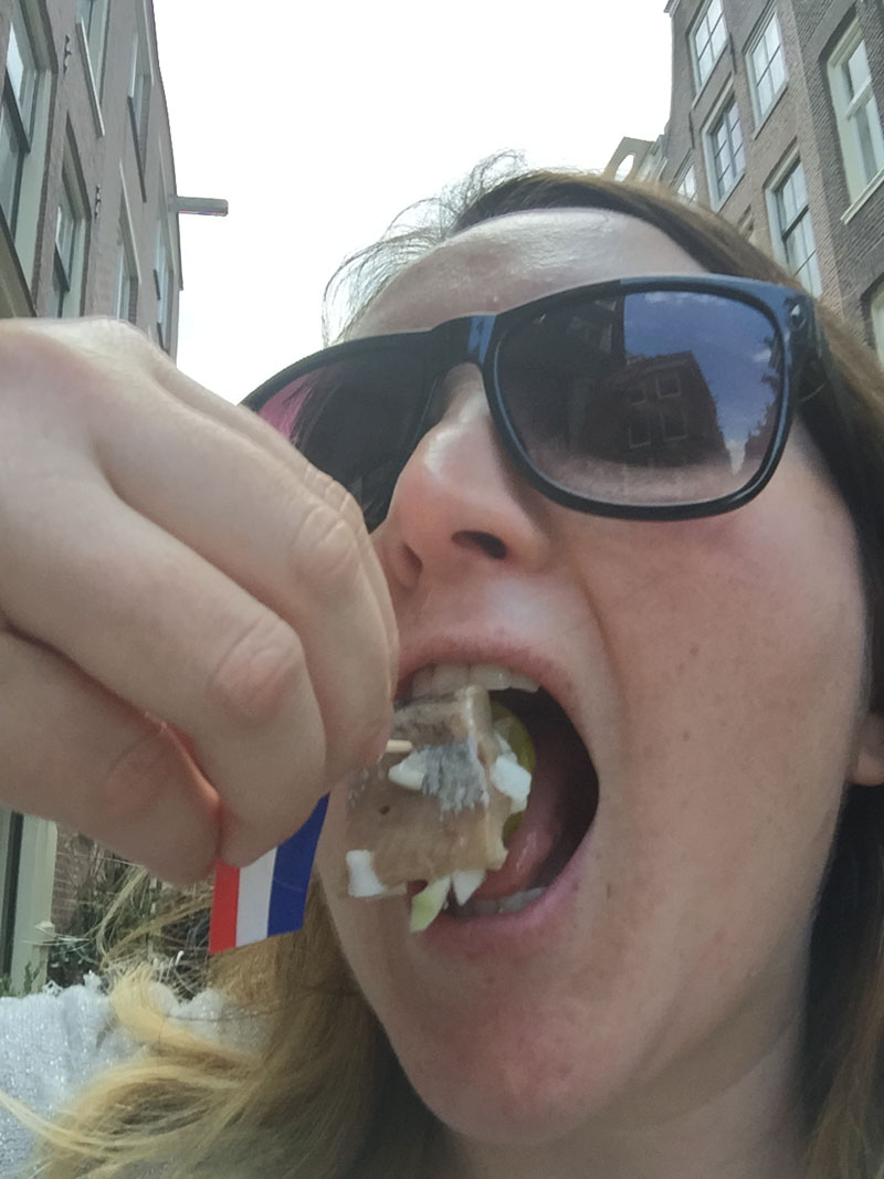 Bethaney Eating Picked Herring, Amsterdam Food Tour
