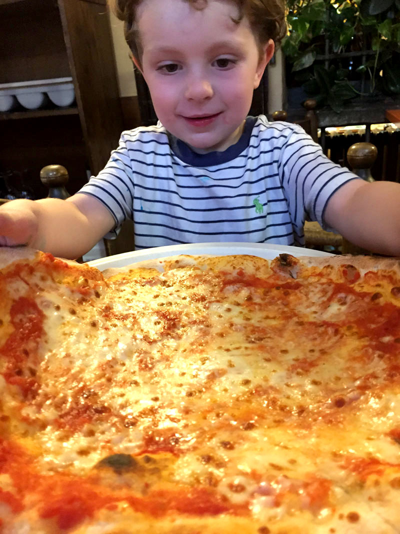 Reuben Eating Pizza in Milan